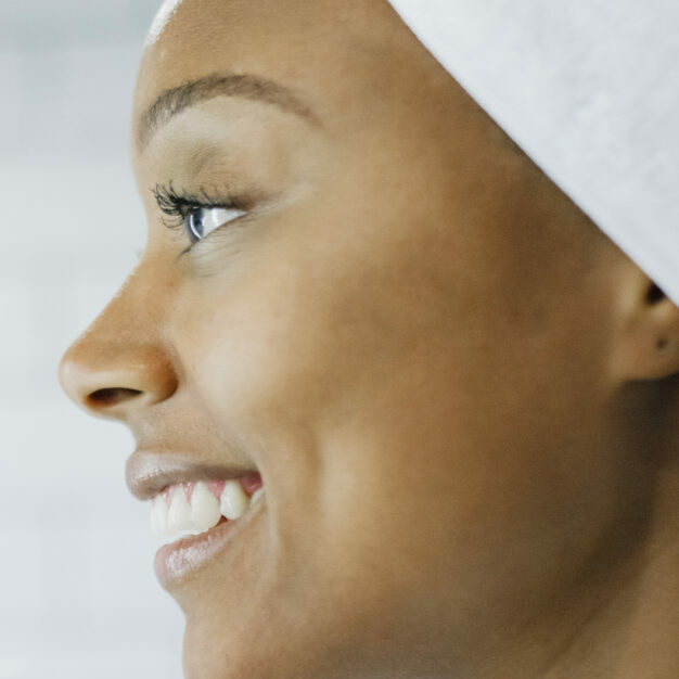 Beautiful woman smiling in the bathroom